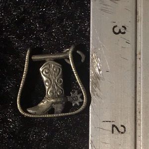 Sterling silver stirrup with a 👢.